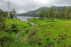 The lake backwaters within the green valley