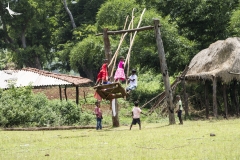 The day of our visit coincided with the last day of Rajoparob so children are seen playing in the large country swing, a probable ritual of this festival