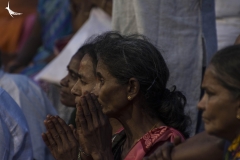 She folds her hands in devotion